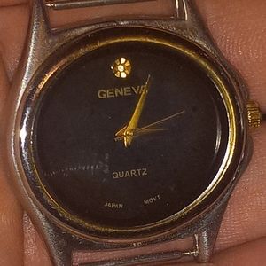Vintage Geneva Quartz Japan Mvt Black Face w/ Single Diamond Accent Stain Steel